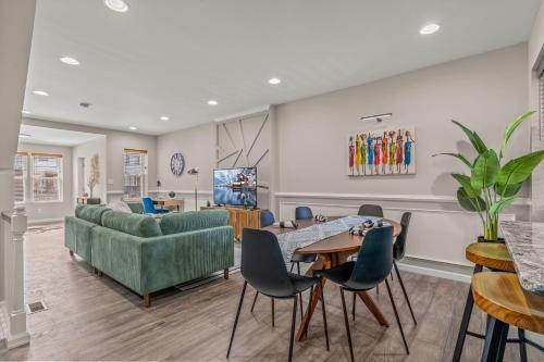 a living room with a couch and a table and chairs at Uptown Gem! Immaculate-Comfort-Character! in Philadelphia