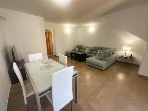 a living room with a couch and a table at Flat 'Hoces del Cabriel' in Casas de Moya 