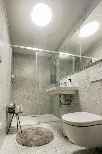 a bathroom with a toilet and a sink and a tub at Chalupa Morava in Veselí nad Moravou