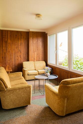 a living room with two chairs and a table at Chalupa Morava in Veselí nad Moravou