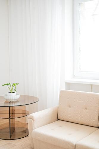 a living room with a chair and a table at Chalupa Morava in Veselí nad Moravou