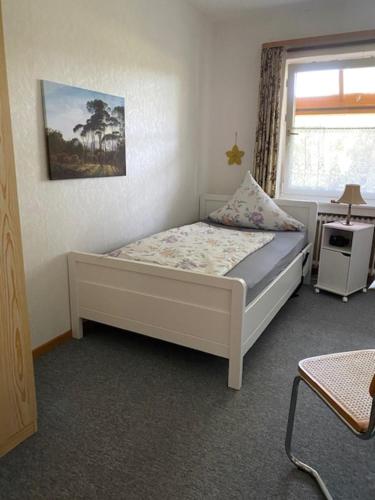 Postel nebo postele na pokoji v ubytování Ferienwohnung Wegener