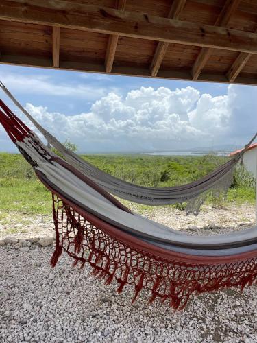 a hammock with a view of the ocean at Altos de la Caobita in Barreras