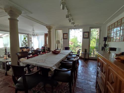 a kitchen and dining room with a table and chairs at Mirador del Ebro - San Vicente de la Sonsierra - La Rioja in San Vicente de la Sonsierra