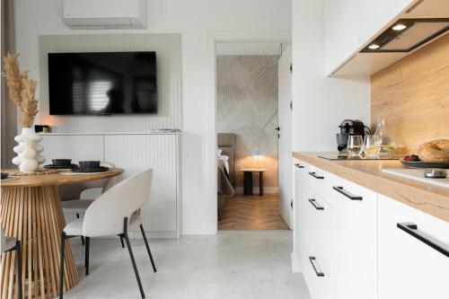 Η κουζίνα ή μικρή κουζίνα στο Apartamenty In Belnihel