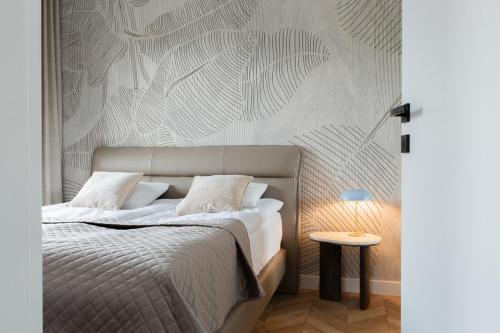 Ένα ή περισσότερα κρεβάτια σε δωμάτιο στο Apartamenty In Belnihel