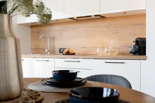 Η κουζίνα ή μικρή κουζίνα στο Apartamenty In Belnihel