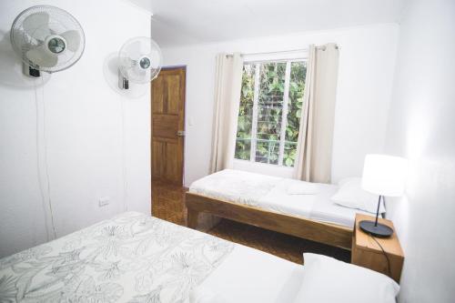Postel nebo postele na pokoji v ubytování Pura Vibra Hostel