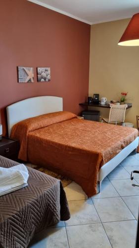 Säng eller sängar i ett rum på Sicily Coast