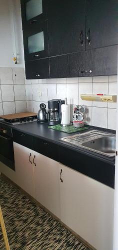 Η κουζίνα ή μικρή κουζίνα στο Relax Apartman