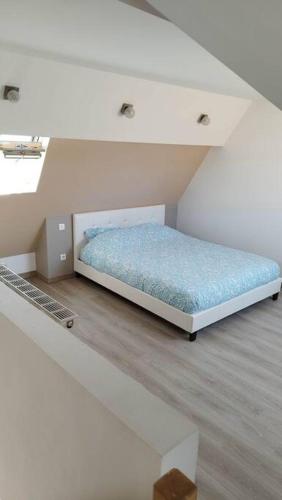 Ένα ή περισσότερα κρεβάτια σε δωμάτιο στο Maison le Portel