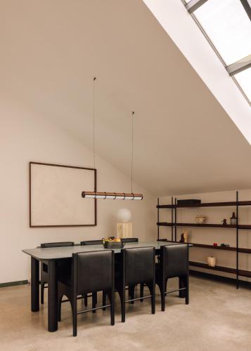 a dining room with a table and black chairs at The Rebello Hotel & Spa - Small Luxury Hotels Of The World in Vila Nova de Gaia