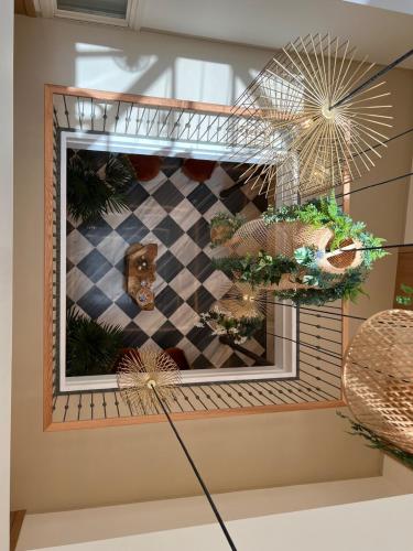 a display of plants on a shelf in a room at Alux Boutique Hotel in Málaga