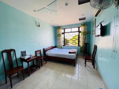 Postel nebo postele na pokoji v ubytování Manh Hung Hotel