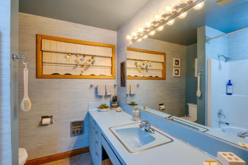 a bathroom with a sink and a mirror at Point Roberts Cottage with Ocean Views and Hot Tub! in Point Roberts