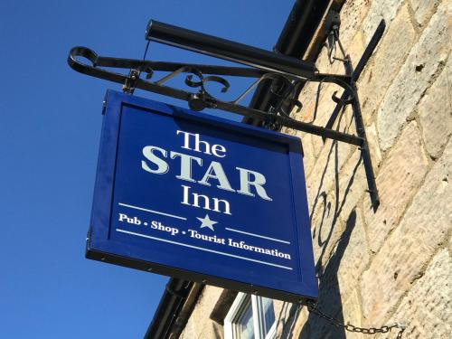 a sign for the star inn hanging on a building at The Star Inn - Harbottle - Near Rothbury - Northumberland in Morpeth