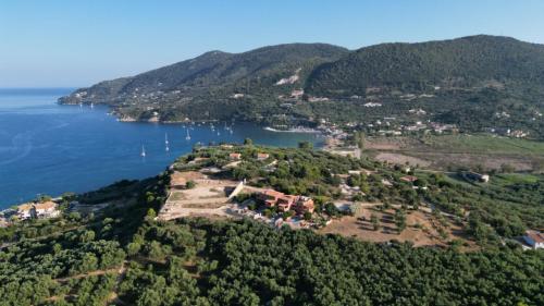 an aerial view of a small island in the water at Athenea Villas, Private Pools & Gardens in Keri
