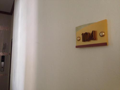 a sign on a wall with the word india on it at NP Residence in Nakhon Phanom
