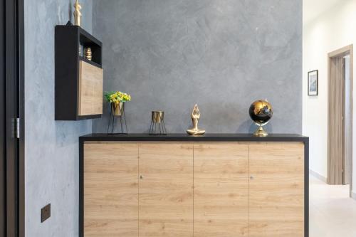 a wooden dresser in a room with a wall at Red Rose in Marsalforn