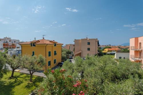 a view of a city with trees and buildings at Residence Mizar 2 in Pietra Ligure