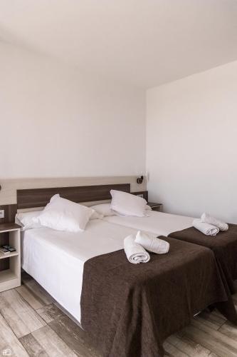 Ein Bett oder Betten in einem Zimmer der Unterkunft Mesón Hostal La Cabaña