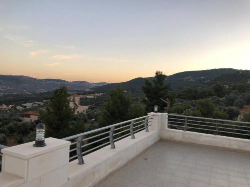 a view from the balcony of a house at The Pine Tree Chalet in Jerash