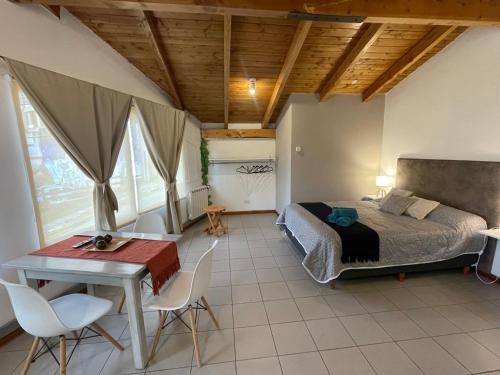 En eller flere senge i et værelse på Loft en zona centrica gastronómica D9