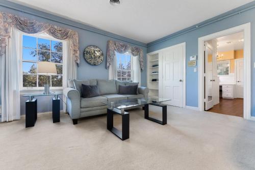a living room with a couch and a table at Presidents House B & B in Plainview
