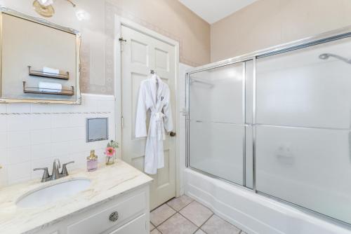 a bathroom with a shower and a sink at Presidents House B & B in Plainview