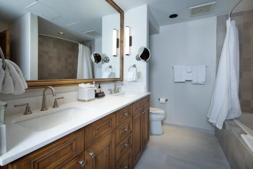 a bathroom with a large sink and a toilet at Gravity Haus Vail in Vail