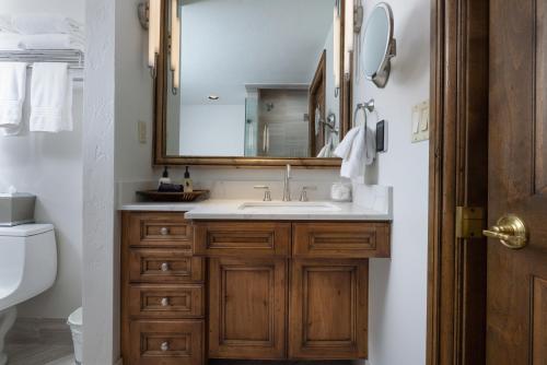 a bathroom with a sink and a mirror at Gravity Haus Vail in Vail