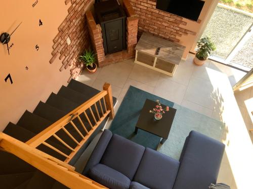 an overhead view of a living room with a couch and a table at Well-being in Eifel in Nettersheim
