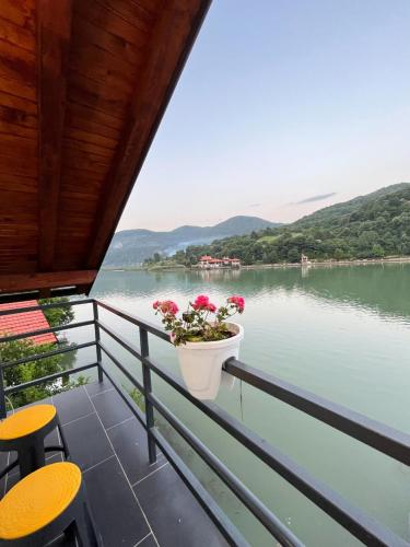 a balcony with a view of a lake at Vikendica Teodora - Zvornik in Zvornik