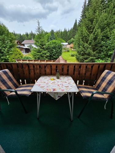 a table and two chairs on a patio at Pension Schatzkisterl in Zwiesel