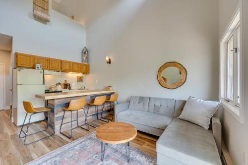 a living room with a couch and a kitchen at Lincoln Condo with Resort Amenities and Mountain Views in Lincoln
