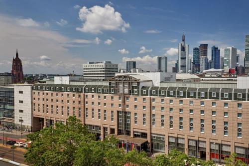a large building with a city in the background at The Westin Grand Frankfurt in Frankfurt/Main