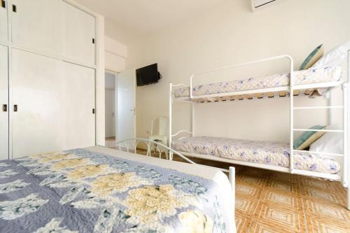 Postel nebo postele na pokoji v ubytování Casa Mariù