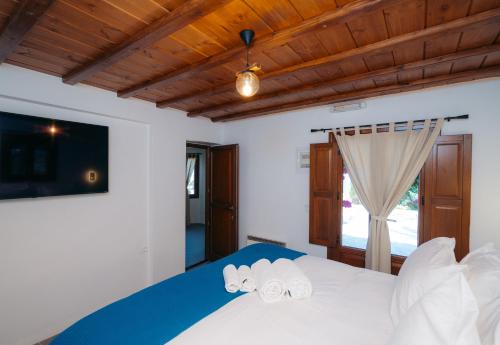 Ένα ή περισσότερα κρεβάτια σε δωμάτιο στο Loukia Apartments