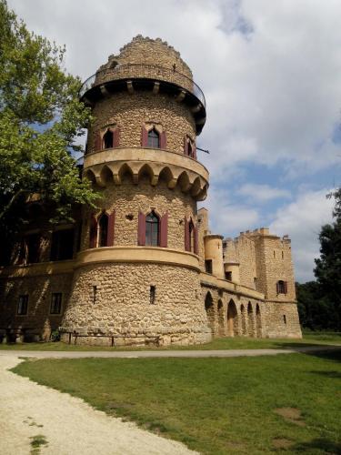 a building with a tower on top of it at Penzion Miromar in Podivín