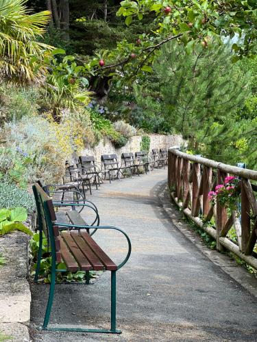 a row of benches sitting on a walkway at Merrion Hotel in Llandudno