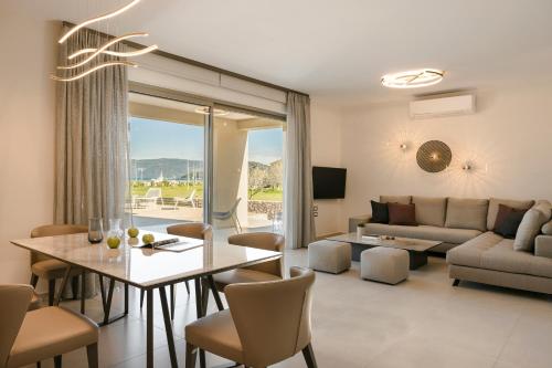 a living room with a table and a couch at Claire villa in Sami