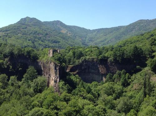 a view of a mountain valley with trees at L'Auberge De Montpezat in Montpezat-sous-Bauzon
