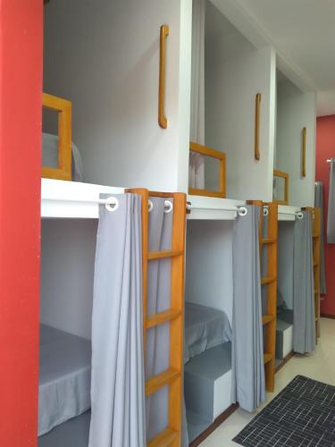 a group of bunk beds in a room at Hostel Flor de Ipê in Barreirinhas