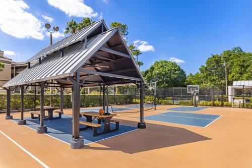 a basketball court with benches on a basketball court at Marriott's Imperial Palms Villas in Orlando