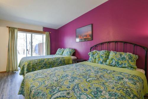 a bedroom with two beds and a purple wall at Near Downtown Adventure Nest - Rose Tree 4 in Moab