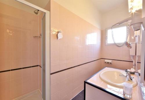 a bathroom with a sink and a shower at Hotel San Donato - Bologna centro in Bologna
