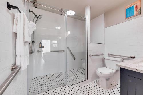a bathroom with a shower and a toilet at Taos Motor Lodge in Taos