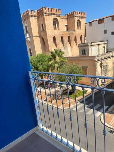 a view of a building from a balcony at M&M rooms Margherita di Savoia in Margherita di Savoia
