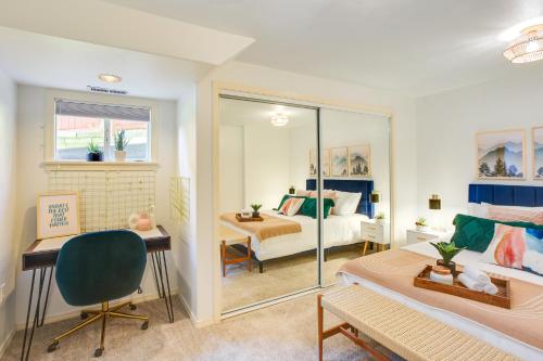 a bedroom with a bed and a desk and a room with a bed at Updated Tacoma Home with Fire Pit! in Tacoma
