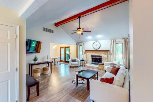 a living room with a couch and a fireplace at Dog-Friendly Yard! Family Retreat in Fort Wayne in Sunnybrook Acres